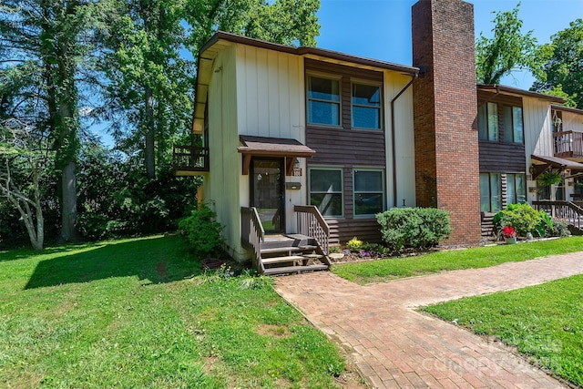 37 Shepard Sq Unit 101, Brevard, NC 28712 - view of property with a front yard and a chimney