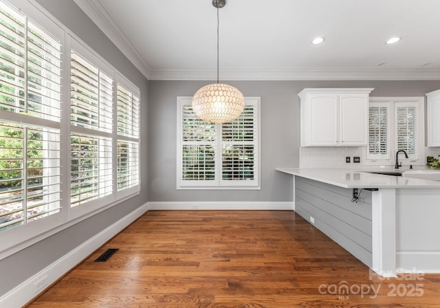 4536 Rustling Woods Dr, Denver, NC 28037 - unfurnished dining area featuring wood finished floors, ornamental molding, and recessed lighting