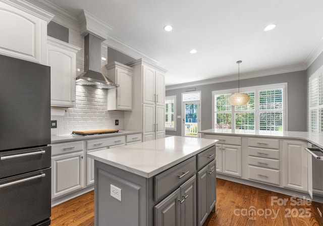 4536 Rustling Woods Dr, Denver, NC 28037 - kitchen with appliances with stainless steel finishes, gray cabinetry, wall chimney range hood, white cabinets, and a center island