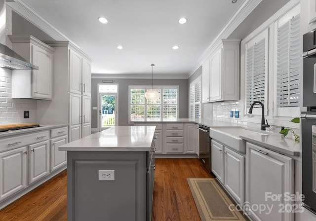 4536 Rustling Woods Dr, Denver, NC 28037 - kitchen with wall chimney exhaust hood, dishwasher, light countertops, dark wood-style floors, and white cabinets