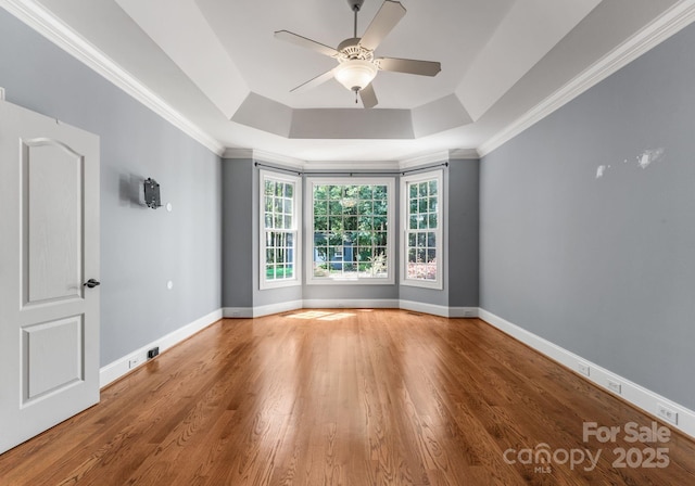 4536 Rustling Woods Dr, Denver, NC 28037 - empty room with a raised ceiling, ceiling fan, wood finished floors, and ornamental molding