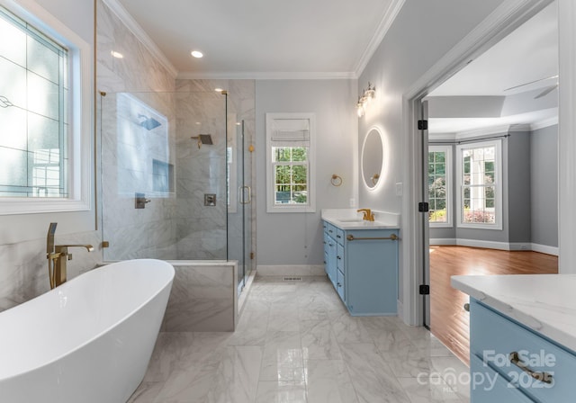 4536 Rustling Woods Dr, Denver, NC 28037 - full bathroom featuring vanity, healthy amount of natural light, a freestanding tub, a shower stall, and ornamental molding