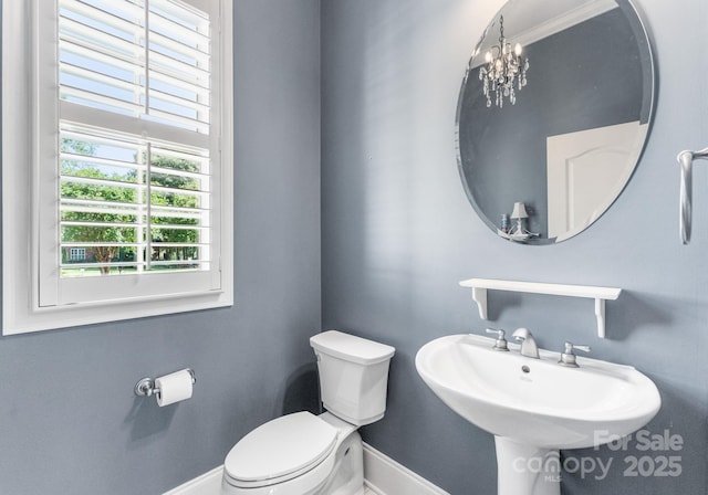 4536 Rustling Woods Dr, Denver, NC 28037 - half bath featuring baseboards and a chandelier