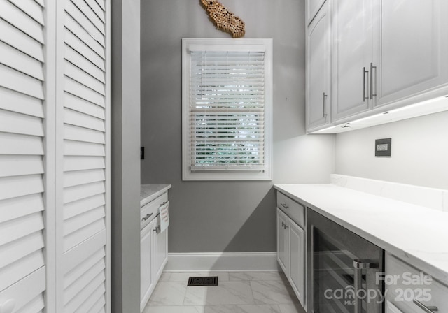 4536 Rustling Woods Dr, Denver, NC 28037 - washroom featuring wine cooler and light marble finish floors