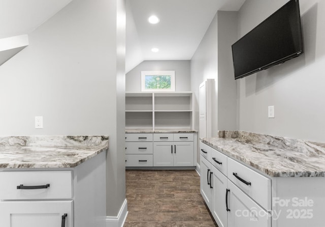 4536 Rustling Woods Dr, Denver, NC 28037 - kitchen with white cabinets, lofted ceiling, recessed lighting, dark wood-style flooring, and light stone countertops
