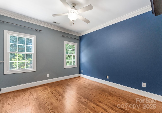 4536 Rustling Woods Dr, Denver, NC 28037 - spare room featuring crown molding, wood finished floors, and a ceiling fan