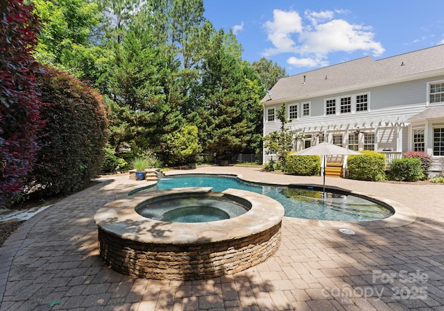 4536 Rustling Woods Dr, Denver, NC 28037 - view of pool featuring a pergola, a pool with connected hot tub, and a patio area