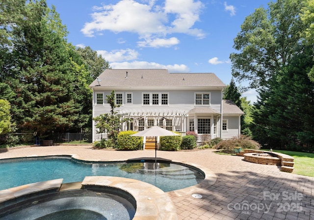 4536 Rustling Woods Dr, Denver, NC 28037 - view of pool featuring a pergola, a patio area, a pool with connected hot tub, and a fire pit