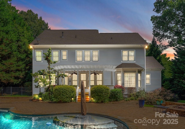 4536 Rustling Woods Dr, Denver, NC 28037 - back of house at dusk featuring a pergola, an outdoor pool, and a patio area