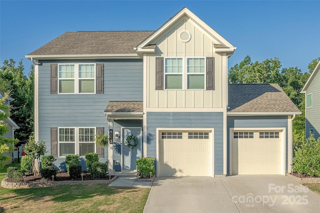 4113 Bent Green Ln, Monroe, NC 28112 - view of front facade with concrete driveway, roof with shingles, board and batten siding, a garage, and a front lawn