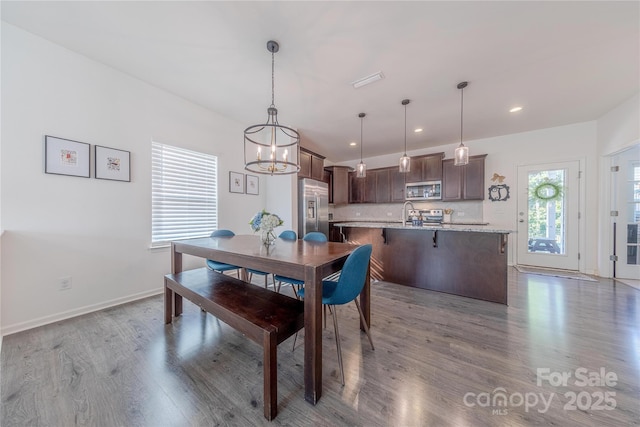4113 Bent Green Ln, Monroe, NC 28112 - dining room featuring wood finished floors, a chandelier, and recessed lighting