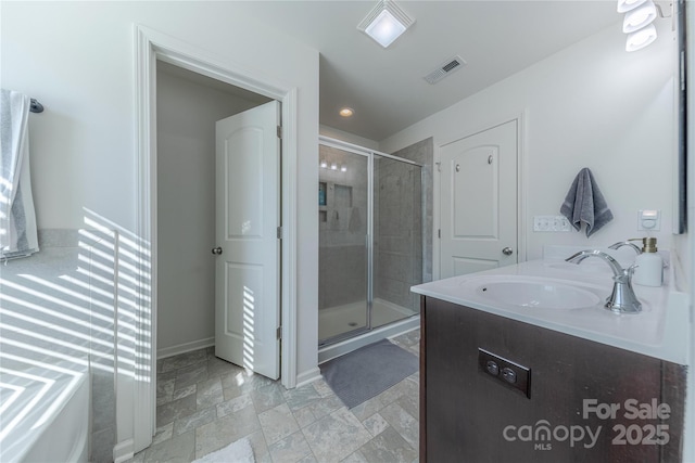 4113 Bent Green Ln, Monroe, NC 28112 - bathroom with a stall shower, vanity, and stone finish floors