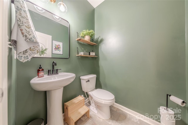 4113 Bent Green Ln, Monroe, NC 28112 - half bathroom featuring toilet and baseboards
