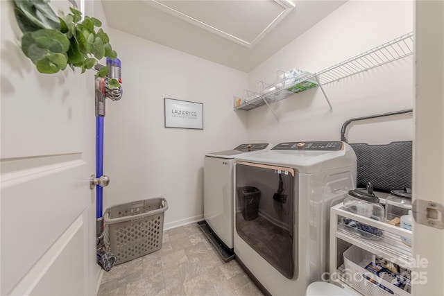 4113 Bent Green Ln, Monroe, NC 28112 - laundry room featuring washing machine and dryer and stone finish flooring