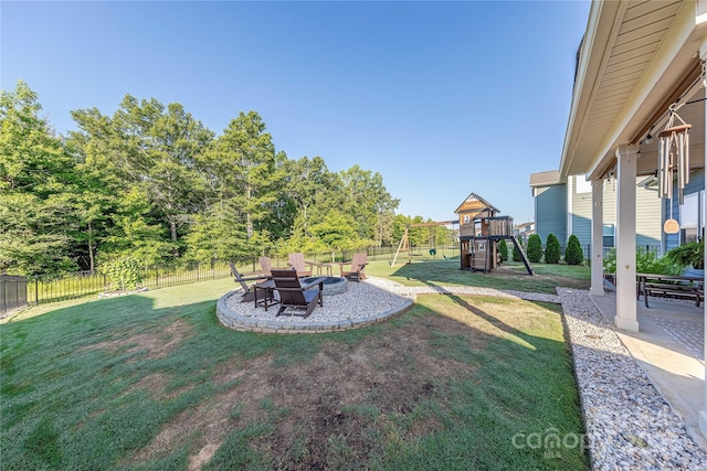 4113 Bent Green Ln, Monroe, NC 28112 - fenced backyard with a playground, a patio, and an outdoor fire pit