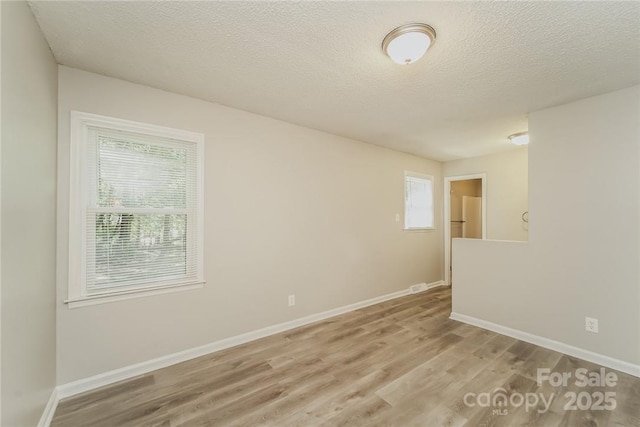 4937 Post Oak Ln, Rock Hill, SC 29732 - unfurnished room with wood finished floors and a textured ceiling
