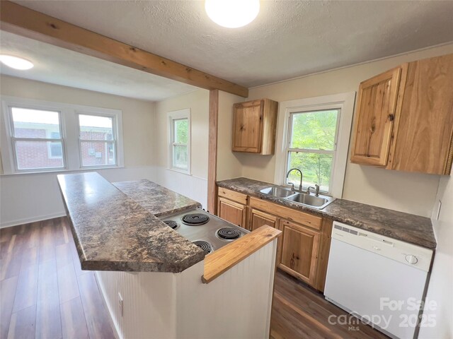 413 Forest Pl NW, Lenoir, NC 28645 - kitchen with white dishwasher, a center island, beam ceiling, dark countertops, and dark wood-style flooring