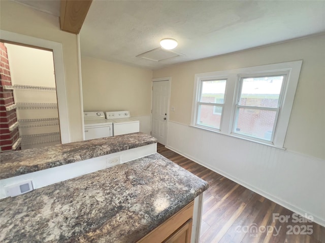 413 Forest Pl NW, Lenoir, NC 28645 - kitchen featuring independent washer and dryer, dark wood-style flooring, and wainscoting