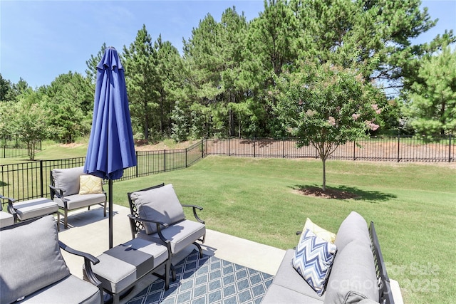 9541 Festival Way, Charlotte, NC 28215 - fenced backyard featuring view of scattered trees, a patio, and an outdoor living space