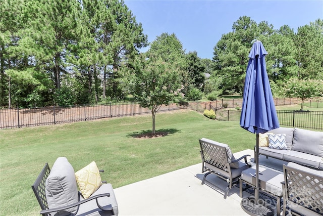 9541 Festival Way, Charlotte, NC 28215 - fenced backyard with outdoor lounge area, a patio area, and view of wooded area
