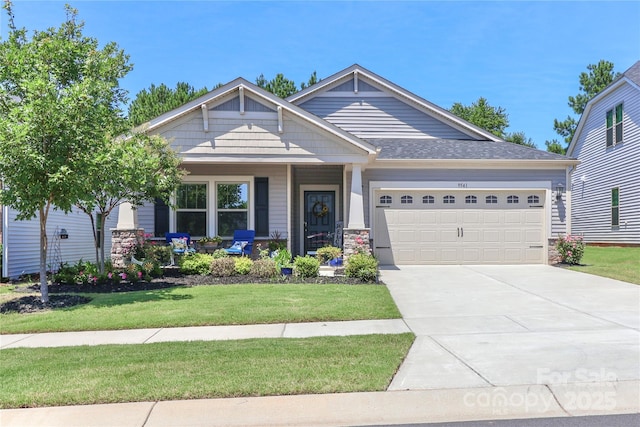9541 Festival Way, Charlotte, NC 28215 - craftsman-style house with an attached garage, a front yard, driveway, covered porch, and stone siding