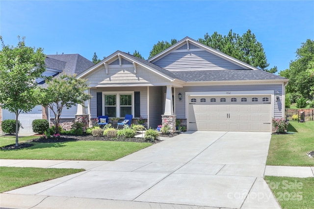 9541 Festival Way, Charlotte, NC 28215 - craftsman inspired home featuring a front lawn, an attached garage, concrete driveway, and covered porch