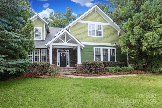 458 Leaf Arbor Ct, Clover, SC 29710 - craftsman-style house with a front lawn, roof with shingles, and stone siding