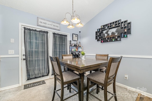 704 Willow Rd, Salisbury, NC 28147 - carpeted dining room with a chandelier and vaulted ceiling