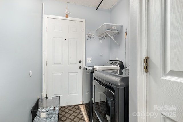 704 Willow Rd, Salisbury, NC 28147 - laundry area featuring washer and dryer and tile patterned floors