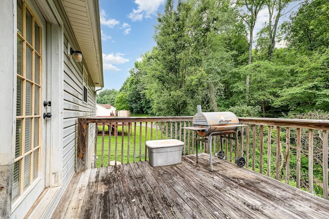 704 Willow Rd, Salisbury, NC 28147 - deck with grilling area, view of scattered trees, and a lawn