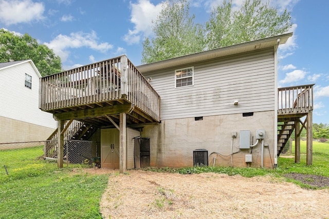 704 Willow Rd, Salisbury, NC 28147 - back of house featuring stairs, a wooden deck, and driveway