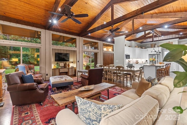 307 E Allenton St, Mount Gilead, NC 27306 - living room featuring a wood ceiling with exposed beams, wood finished floors, ceiling fan, healthy amount of natural light, and high vaulted ceiling