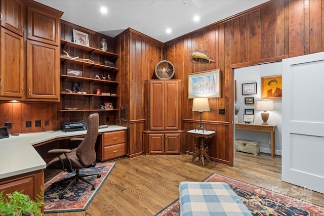 307 E Allenton St, Mount Gilead, NC 27306 - home office with built in desk, wooden walls, and light wood finished floors