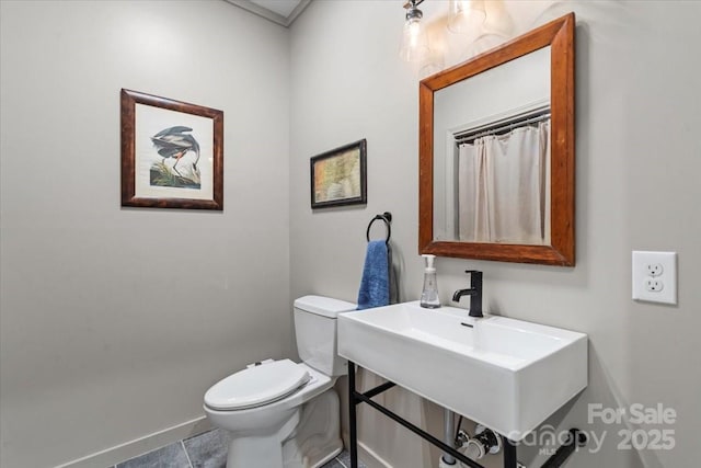 307 E Allenton St, Mount Gilead, NC 27306 - bathroom with baseboards and toilet