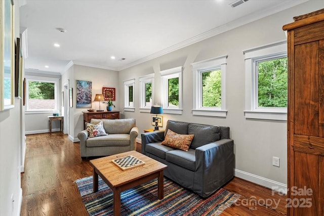 307 E Allenton St, Mount Gilead, NC 27306 - living area with healthy amount of natural light, dark wood-type flooring, ornamental molding, and recessed lighting