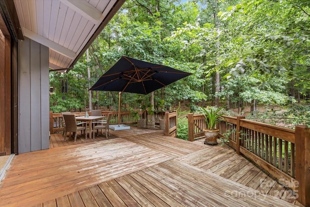 307 E Allenton St, Mount Gilead, NC 27306 - wooden terrace featuring outdoor dining space and view of wooded area