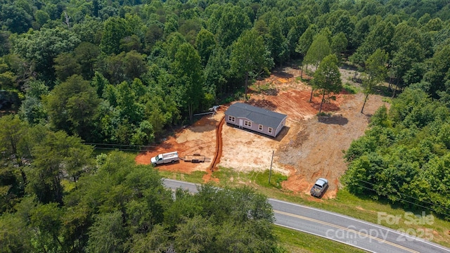 1853 Hill River Rd Unit 1, Hiddenite, NC 28636 - aerial view of property and surrounding area featuring a heavily wooded area