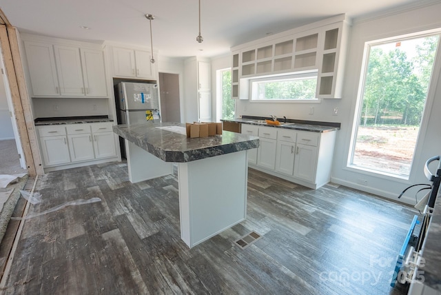 1853 Hill River Rd Unit 1, Hiddenite, NC 28636 - kitchen featuring dark countertops, dark wood finished floors, a kitchen island, and white cabinets