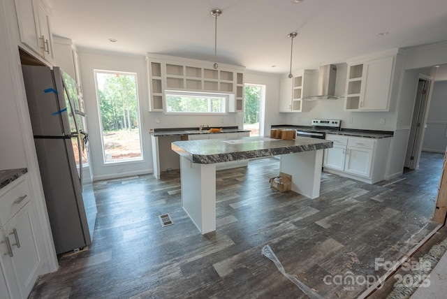 1853 Hill River Rd Unit 1, Hiddenite, NC 28636 - kitchen featuring open shelves, wall chimney range hood, freestanding refrigerator, electric range, and a kitchen island