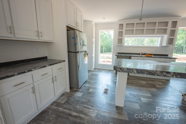 1853 Hill River Rd Unit 1, Hiddenite, NC 28636 - kitchen with freestanding refrigerator, healthy amount of natural light, open shelves, white cabinetry, and ornamental molding