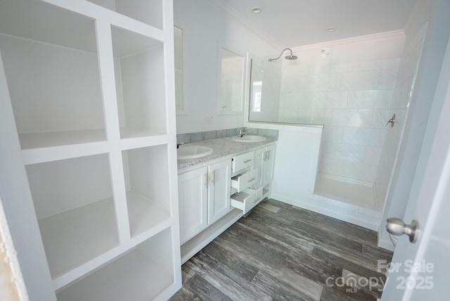 1853 Hill River Rd Unit 1, Hiddenite, NC 28636 - bathroom with a walk in shower, double vanity, ornamental molding, and wood finished floors