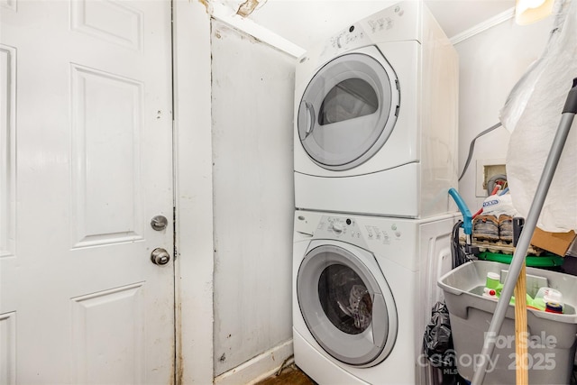 822 Cantwell St, Charlotte, NC 28208 - washroom featuring stacked washer / dryer and crown molding