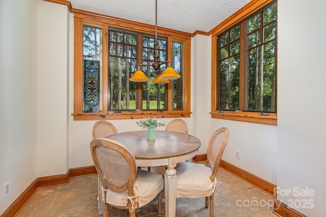 177 Yadkin Falls Rd, New London, NC 28127 - dining space with ornamental molding and stone finish flooring