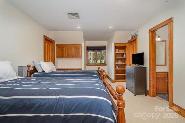 177 Yadkin Falls Rd, New London, NC 28127 - bedroom with light colored carpet, recessed lighting, and ensuite bath