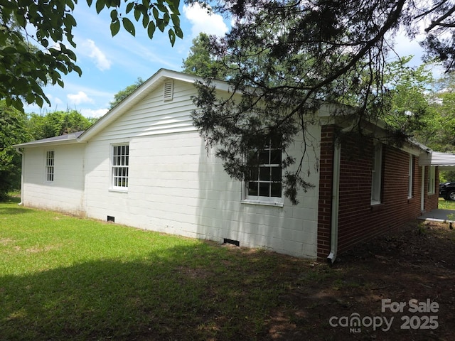 6820 Butterfly Ln, Kershaw, SC 29067 - view of property exterior with a lawn and crawl space