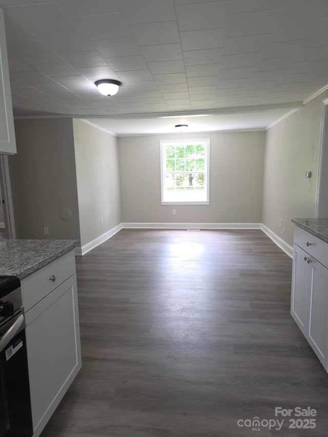 6820 Butterfly Ln, Kershaw, SC 29067 - unfurnished dining area featuring dark wood-style floors and ornamental molding