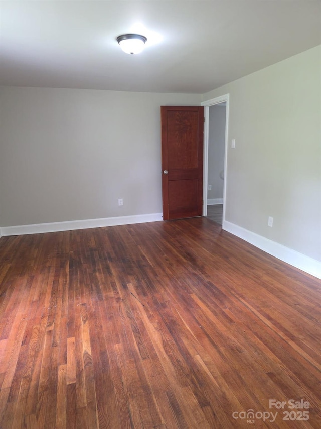 6820 Butterfly Ln, Kershaw, SC 29067 - empty room featuring dark wood-style flooring and baseboards