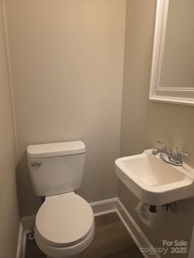 6820 Butterfly Ln, Kershaw, SC 29067 - bathroom with baseboards and wood finished floors