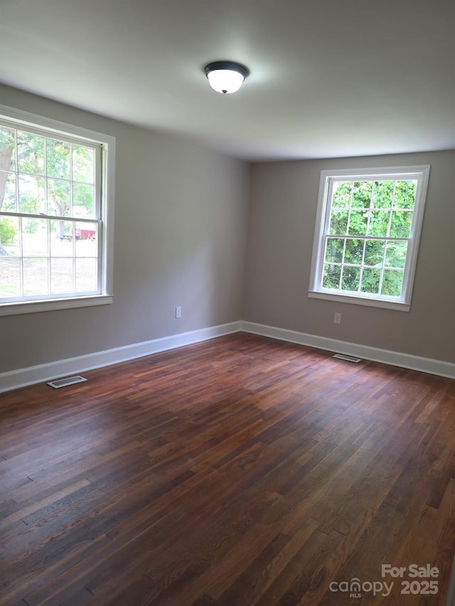 6820 Butterfly Ln, Kershaw, SC 29067 - spare room featuring dark wood finished floors and baseboards