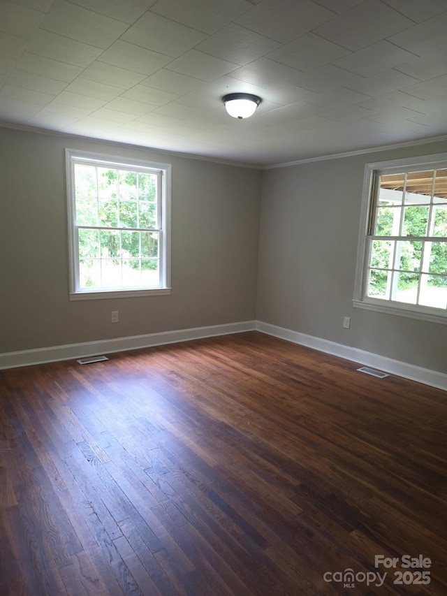 6820 Butterfly Ln, Kershaw, SC 29067 - spare room with dark wood-style floors and crown molding
